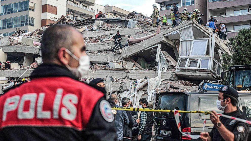 PHOTO: Rescuers search for survivors at a collapsed building after a powerful earthquake struck Turkey's western coast and parts of Greece, in Izmir, on Oct. 30, 2020.