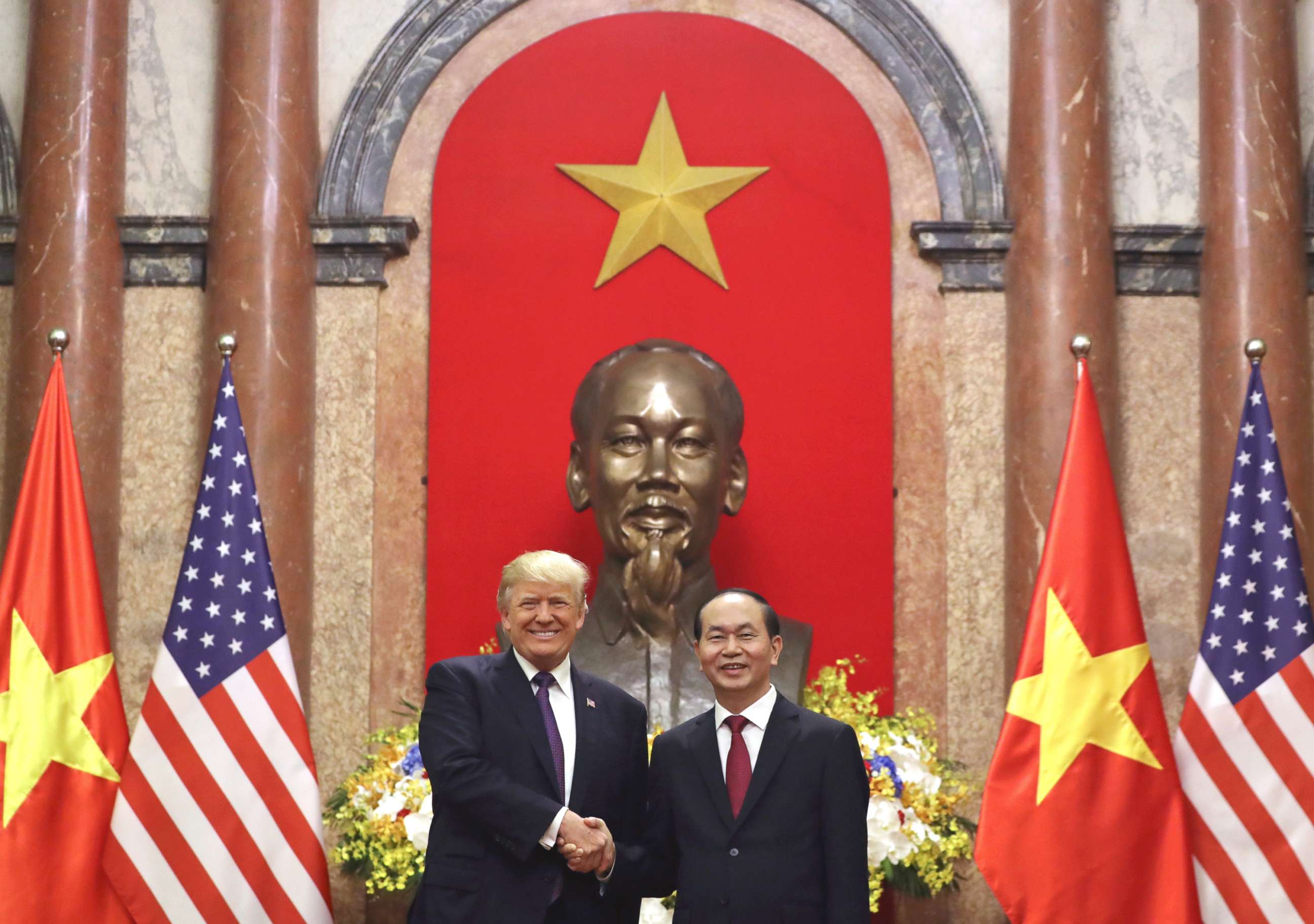 PHOTO: President Donald Trump, left, and Vietnamese President Tran Dai Quang shake hands at the Presidential Palace, Nov. 12, 2017, in Hanoi, Vietnam.