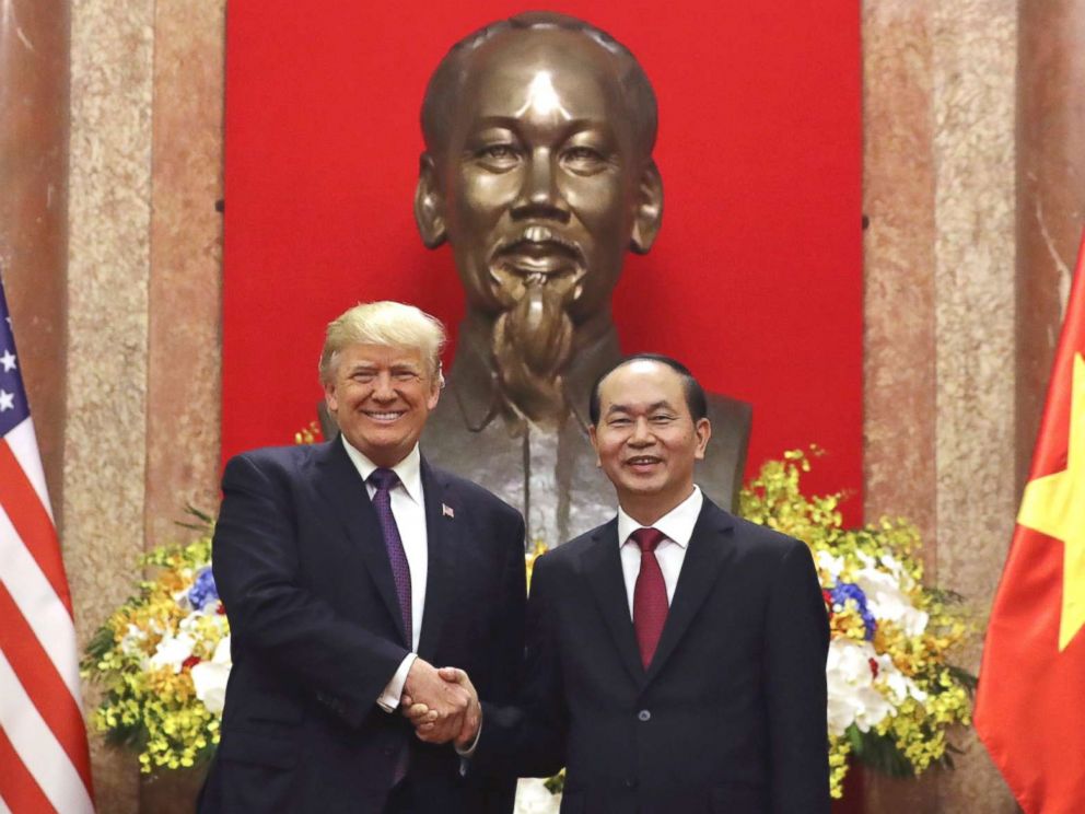 PHOTO: President Donald Trump, left, and Vietnamese President Tran Dai Quang shake hands at the Presidential Palace, Nov. 12, 2017, in Hanoi, Vietnam.