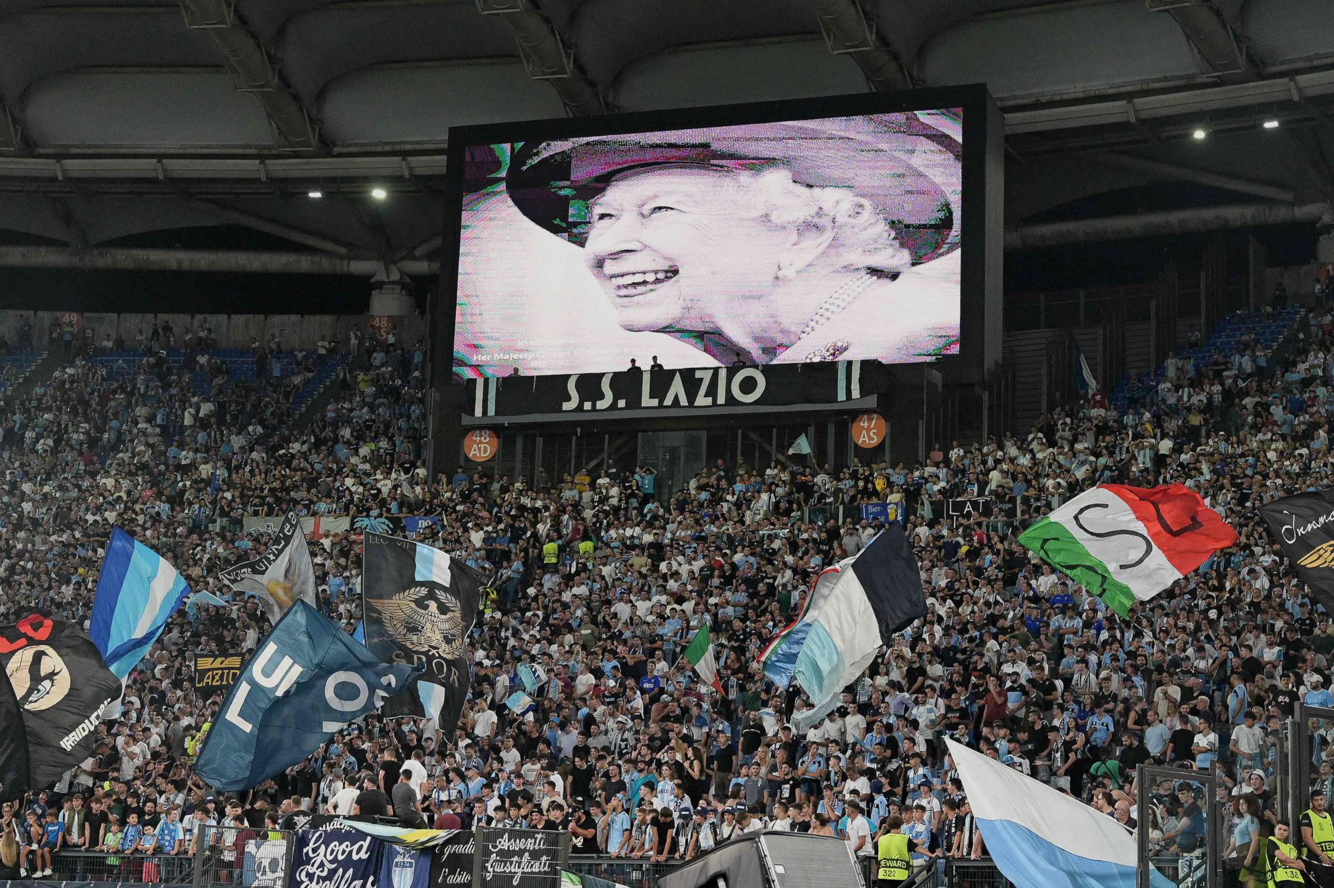 PHOTO: A portrait of Britain's Queen Elizabeth is displayed on a giant screen following the announcement of her death at the Olympic stadium in Rome, Sept. 8, 2022.