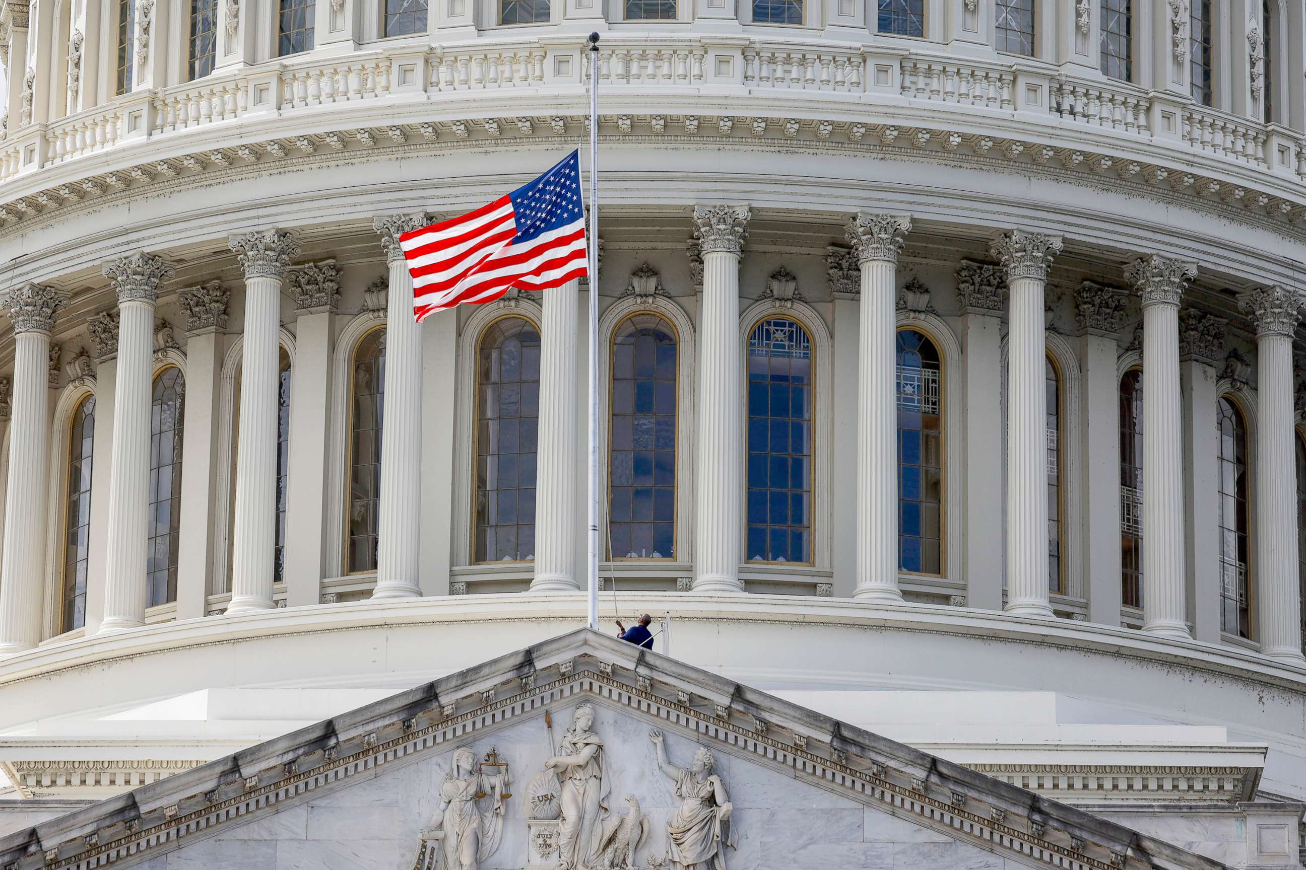 PHOTO: The flag above the U.S. Capitol is brought to half-staff in Washington, Sept. 08, 2022.