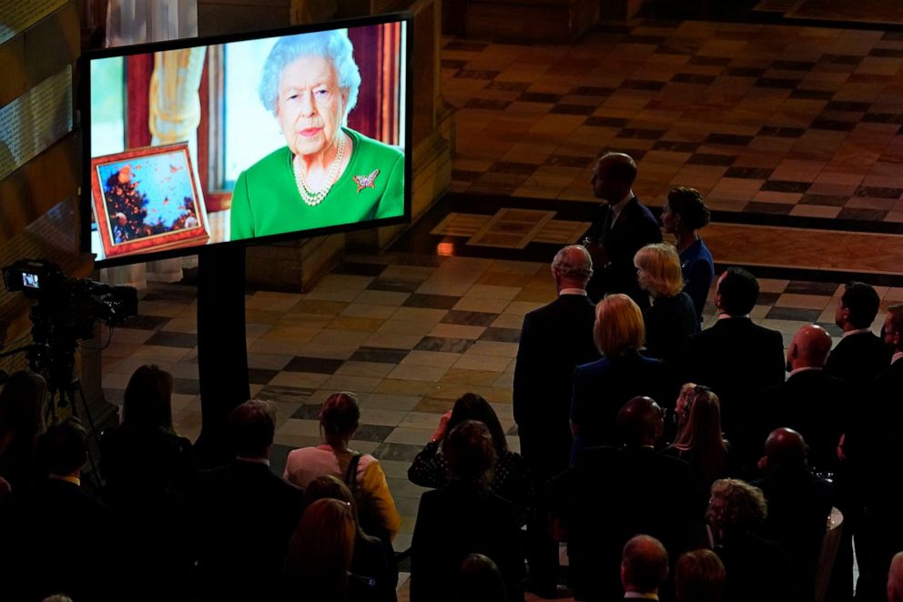PHOTO: Britain's Queen Elizabeth II appears on a large screen as she makes a video message to attendees of an evening reception to mark the opening day of the COP26 summit, on Nov. 1, 2021, in Glasgow, United Kingdom.
