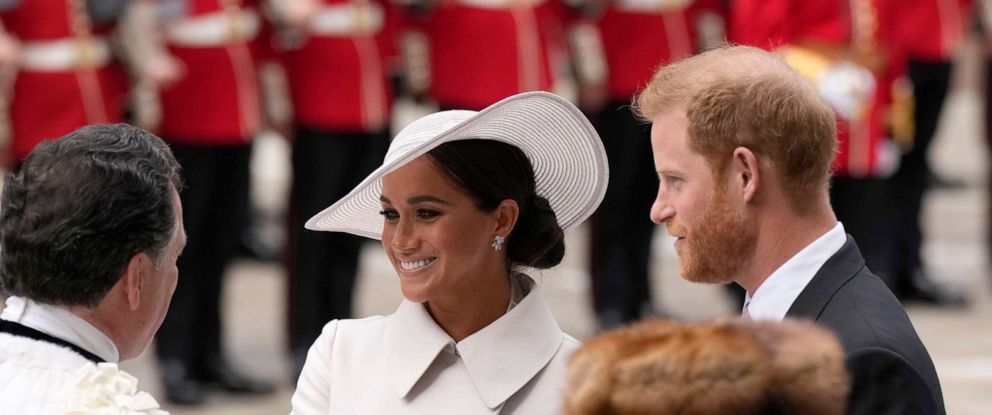 Meghan Markle smiles warmly at Princess Charlotte after procession