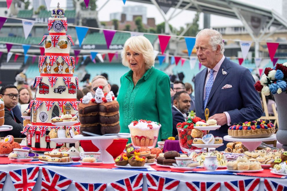 PHOTO: Prince Charles, the Prince and Camilla Duchess of Cornwall look at hand-sewn street party decorations as they attend The Big Lunch at the Oval Kennington to celebrate Britain's Queen Elizabeth II Platinum Jubilee in London, Britain, June 5, 2022. 