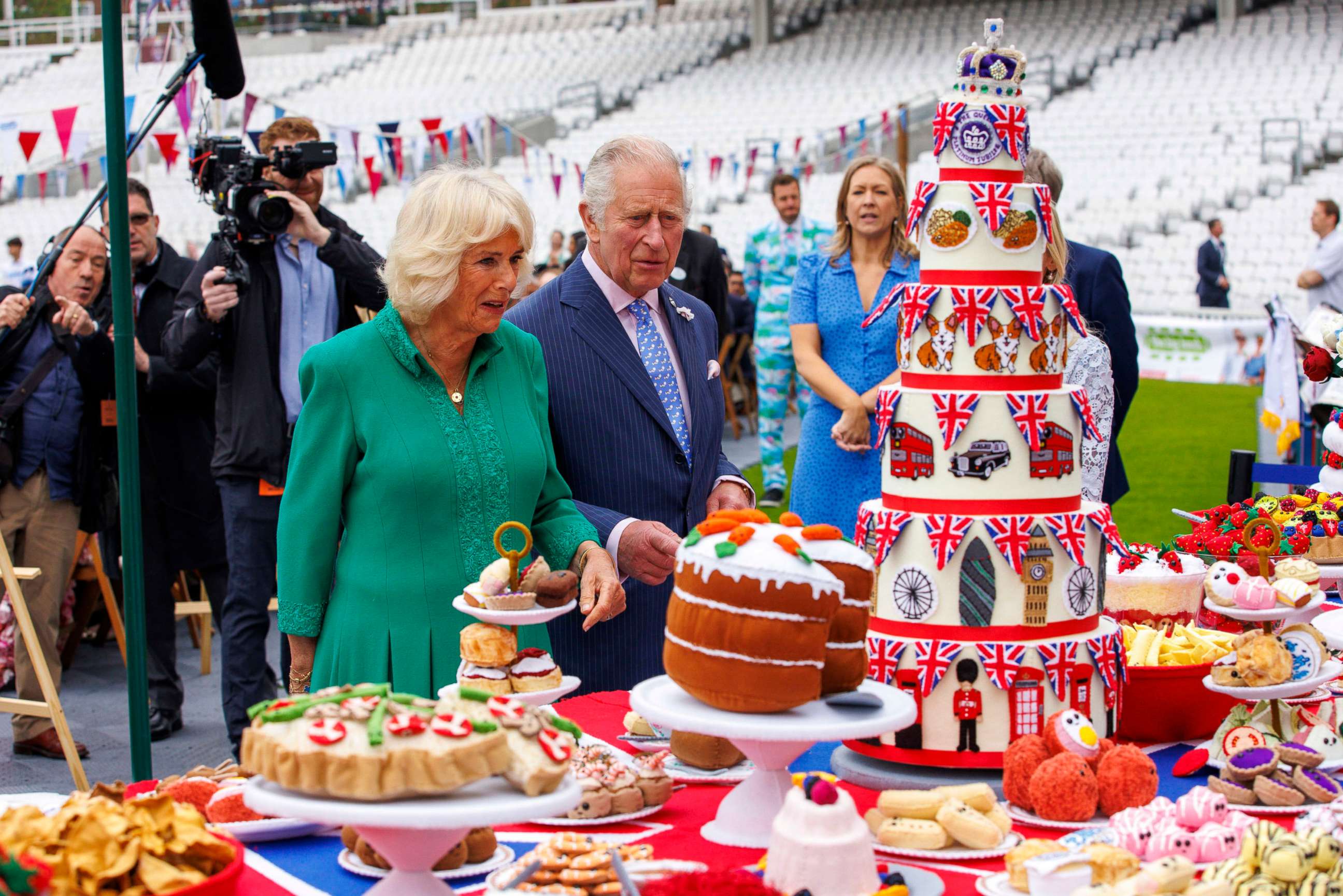 PHOTO: Prince Charles and Camilla Duchess of Cornwall look at hand-sewn street party decorations as they attend The Big Lunch at the Oval Kennington to celebrate Britain's Queen Elizabeth II Platinum Jubilee in London, Britain, June 5, 2022. 