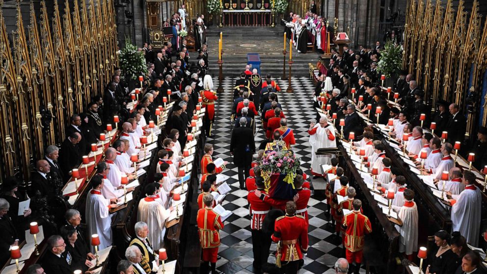 PHOTO: The coffin of Queen Elizabeth II, draped in a Royal Standard and adorned with the Imperial State Crown and the Sovereign's orb and sceptre arrives at Westminster Abbey in London, Sept. 19, 2022. 