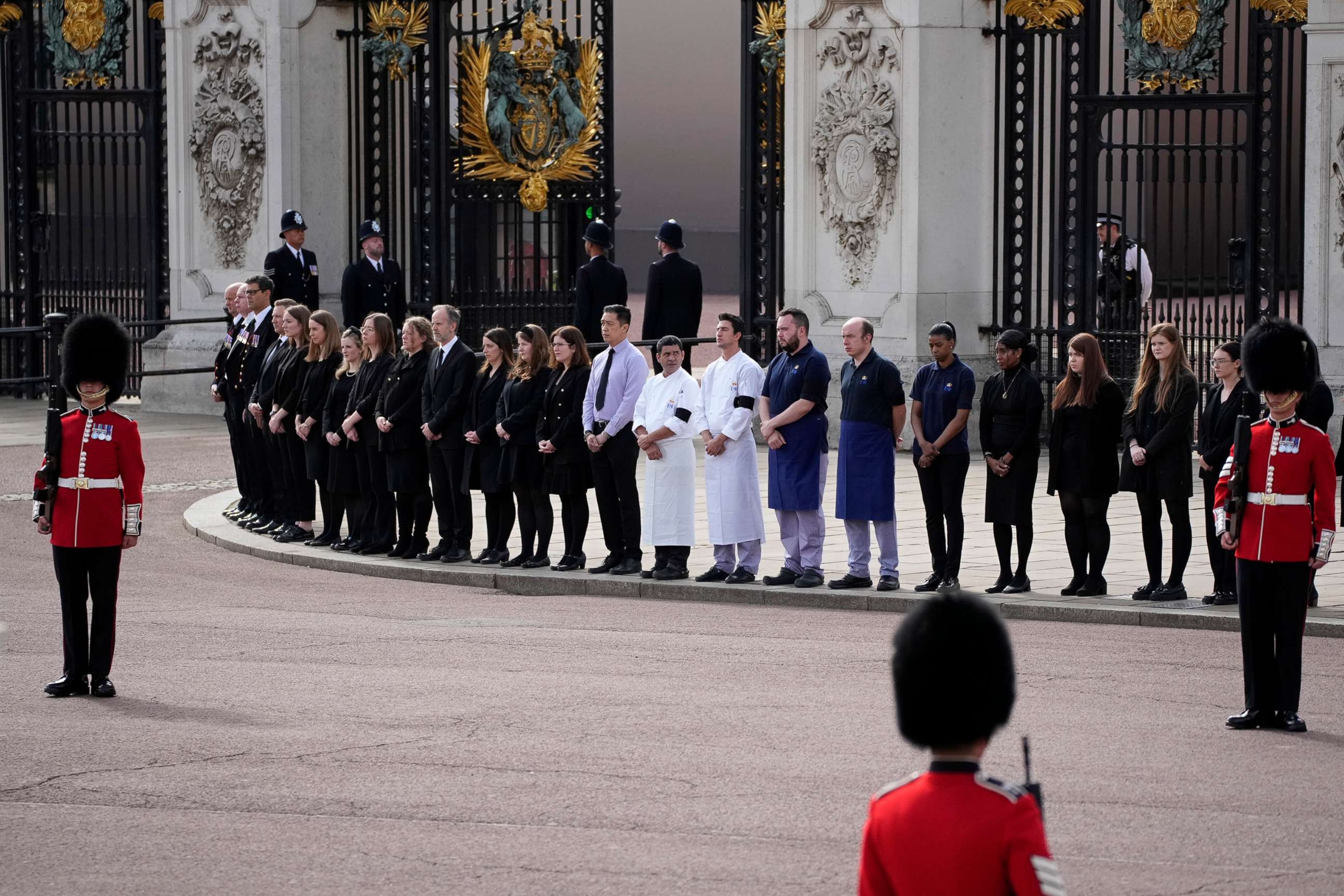 PHOTO: Buckingham Palace staff stand outside its gates during Queen Elizabeth II funeral ceremonies in central London, Sept. 19, 2022.