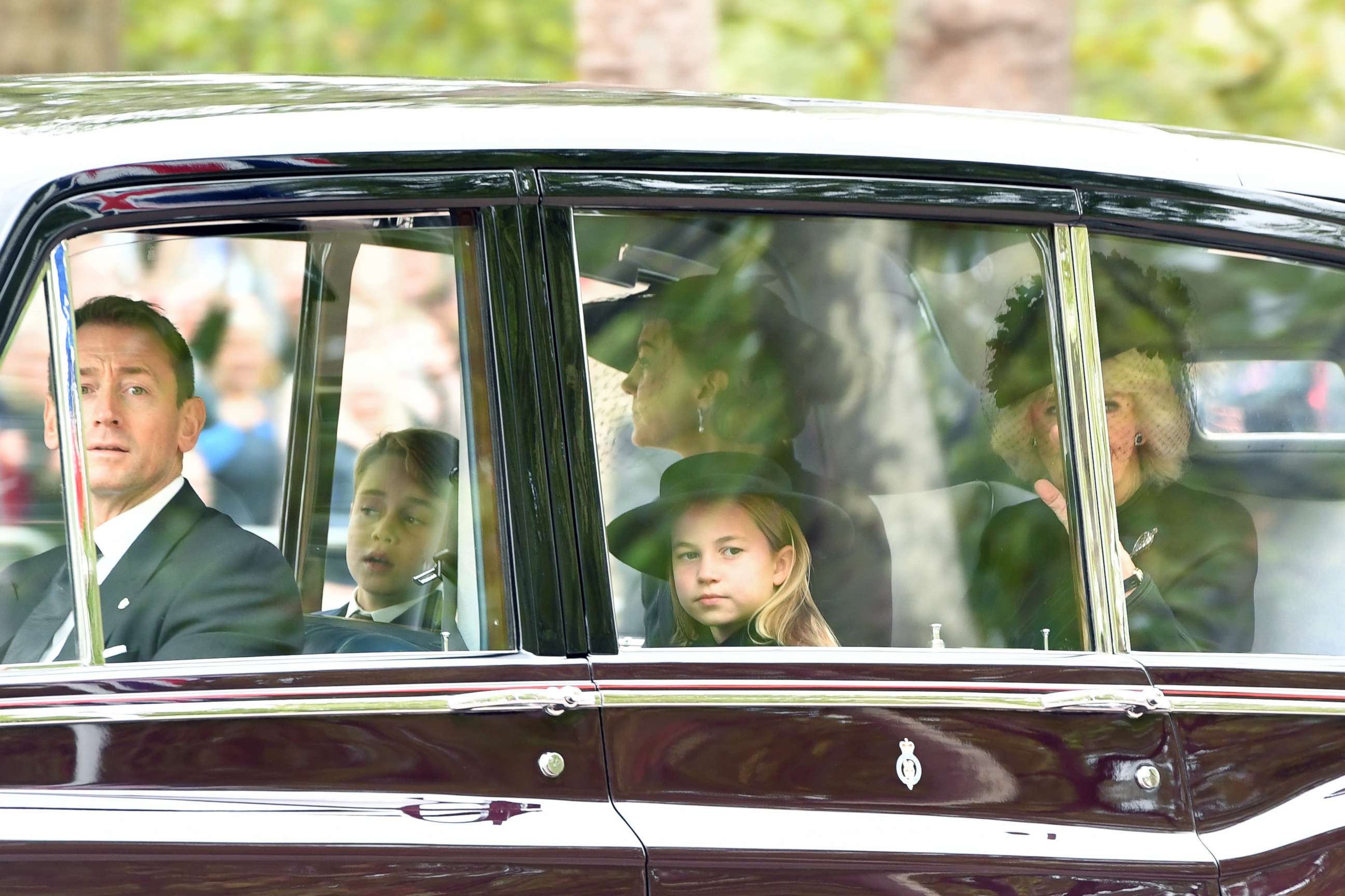 PHOTO: Prince George of Wales, Princess Charlotte of Wales, Catherine, Princess of Wales and Camilla, Queen consort are seen on The Mall ahead of The State Funeral for Queen Elizabeth II on Sept. 19, 2022 in London.