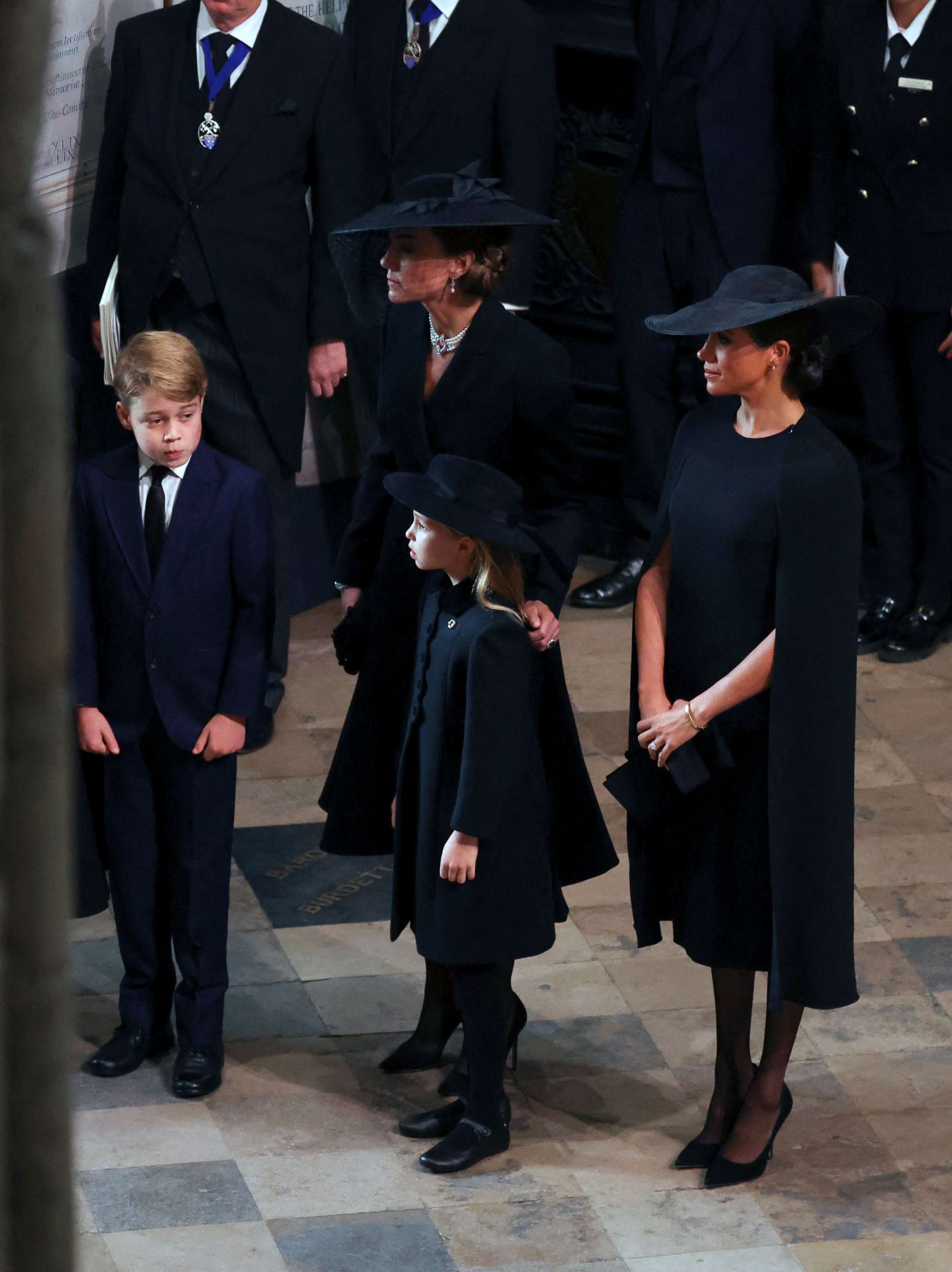 PHOTO: Kate, Princess of Wales, Meghan, Duchess of Sussex, Prince George and Princess Charlotte arrive at the Westminster Abbey for the funeral of Queen Elizabeth II, in London, Sept. 19, 2022.