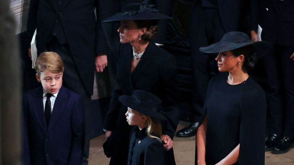 PHOTO: Kate, Princess of Wales, Meghan, Duchess of Sussex, Prince George and Princess Charlotte arrive at the Westminster Abbey for the funeral of Queen Elizabeth II, in London, Sept. 19, 2022.