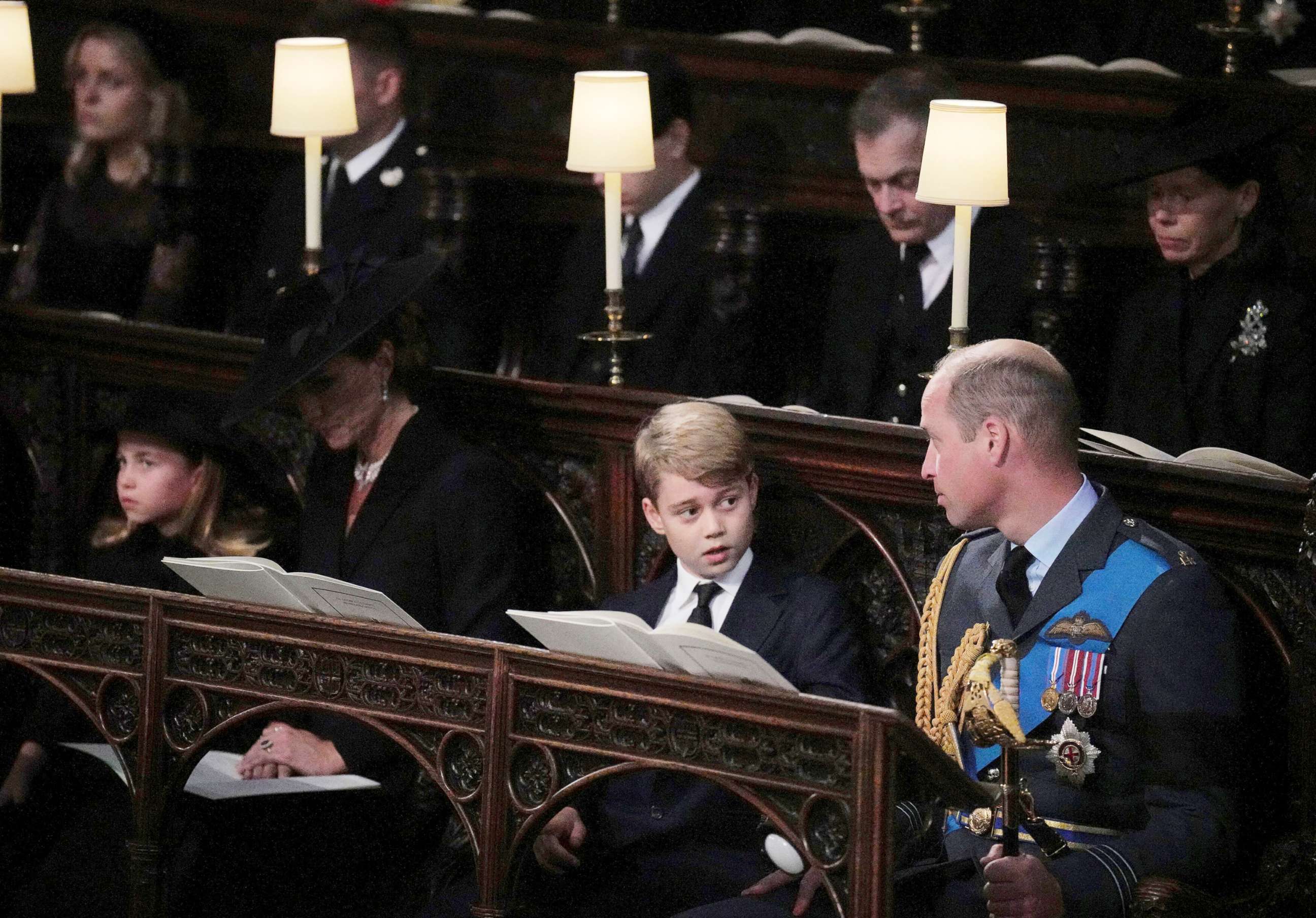 PHOTO: Princess Charlotte, Kate, the Princess of Wales, Prince George, and  Prince William, the Prince of Wales, sit, during the  committal service for Queen Elizabeth II, at St. George's Chapel, in Windsor, England, Sept. 19, 2022.