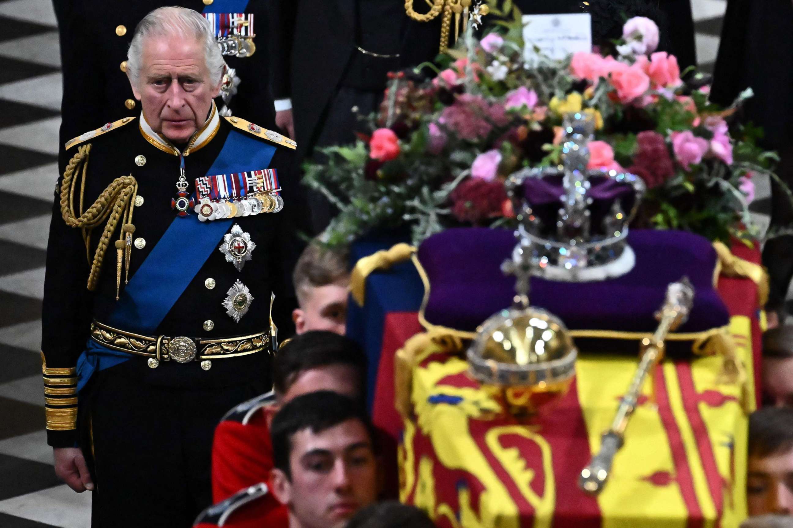 PHOTO: Britain's King Charles III walks beside The coffin of Queen Elizabeth II, draped in a Royal Standard and adorned with the Imperial State Crown and the Sovereign's orb and sceptre as it leaves Westminster Abbey in London, on Sept. 19, 2022. 