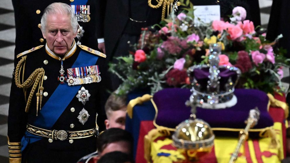 PHOTO: Britain's King Charles III walks beside The coffin of Queen Elizabeth II, draped in a Royal Standard and adorned with the Imperial State Crown and the Sovereign's orb and sceptre as it leaves Westminster Abbey in London, on Sept. 19, 2022. 