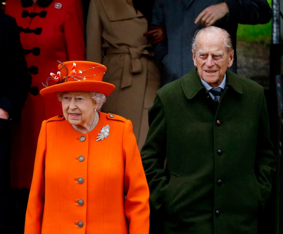 PHOTO: Britain's Queen Elizabeth II and Prince Philip, wait for their car following the traditional Christmas Day church service, at St. Mary Magdalene Church in Sandringham, England.