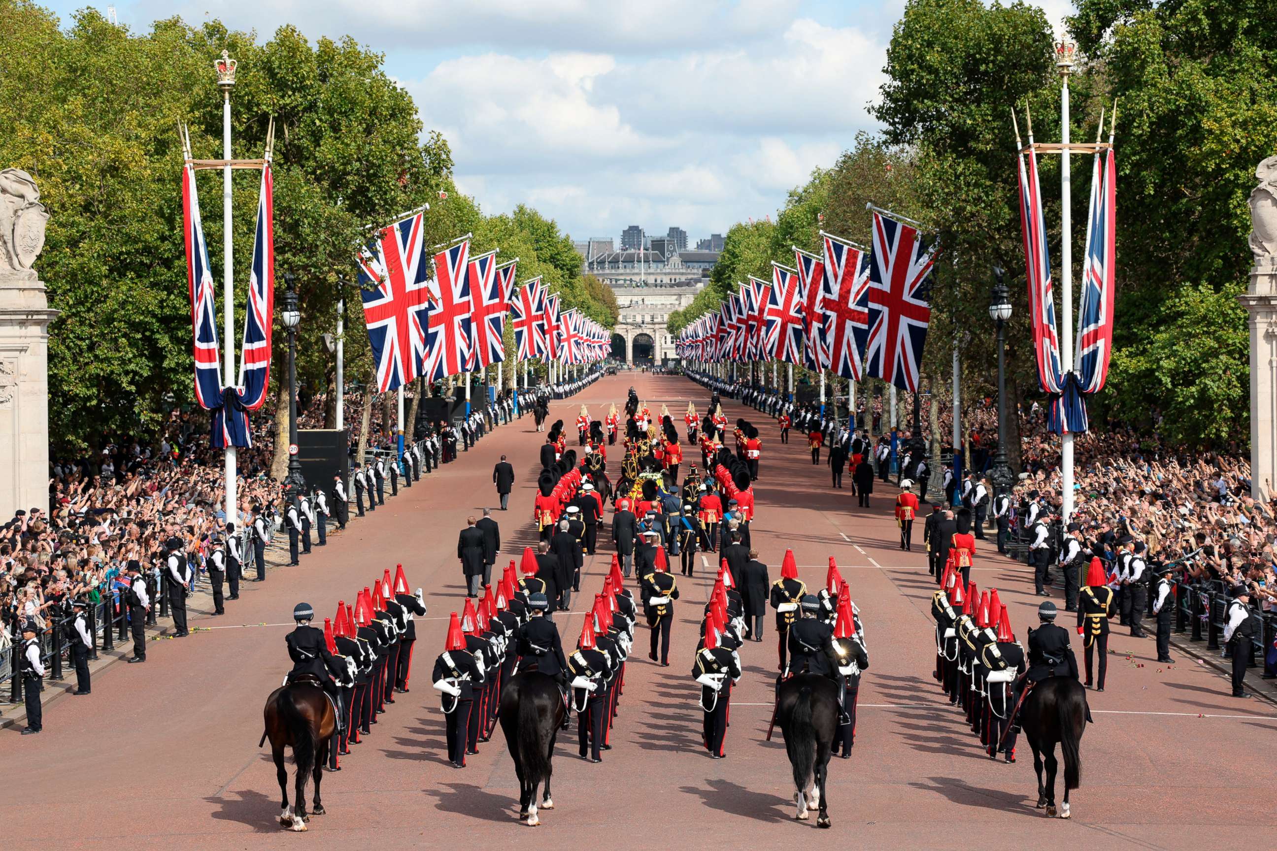 PHOTO: Members of the armed forces help carry the coffin of Queen Elizabeth II during  a procession from Buckingham Palace to Westminster Hall in London, Sept. 14, 2022. 