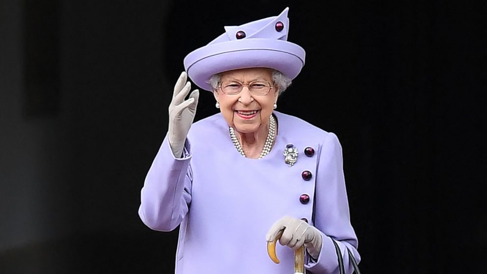PHOTO: In this file photo taken on June 28, 2022 Britain's Queen Elizabeth II waves as she attends an Armed Forces Act of Loyalty Parade at the Palace of Holyroodhouse in Edinburgh, Scotland. 