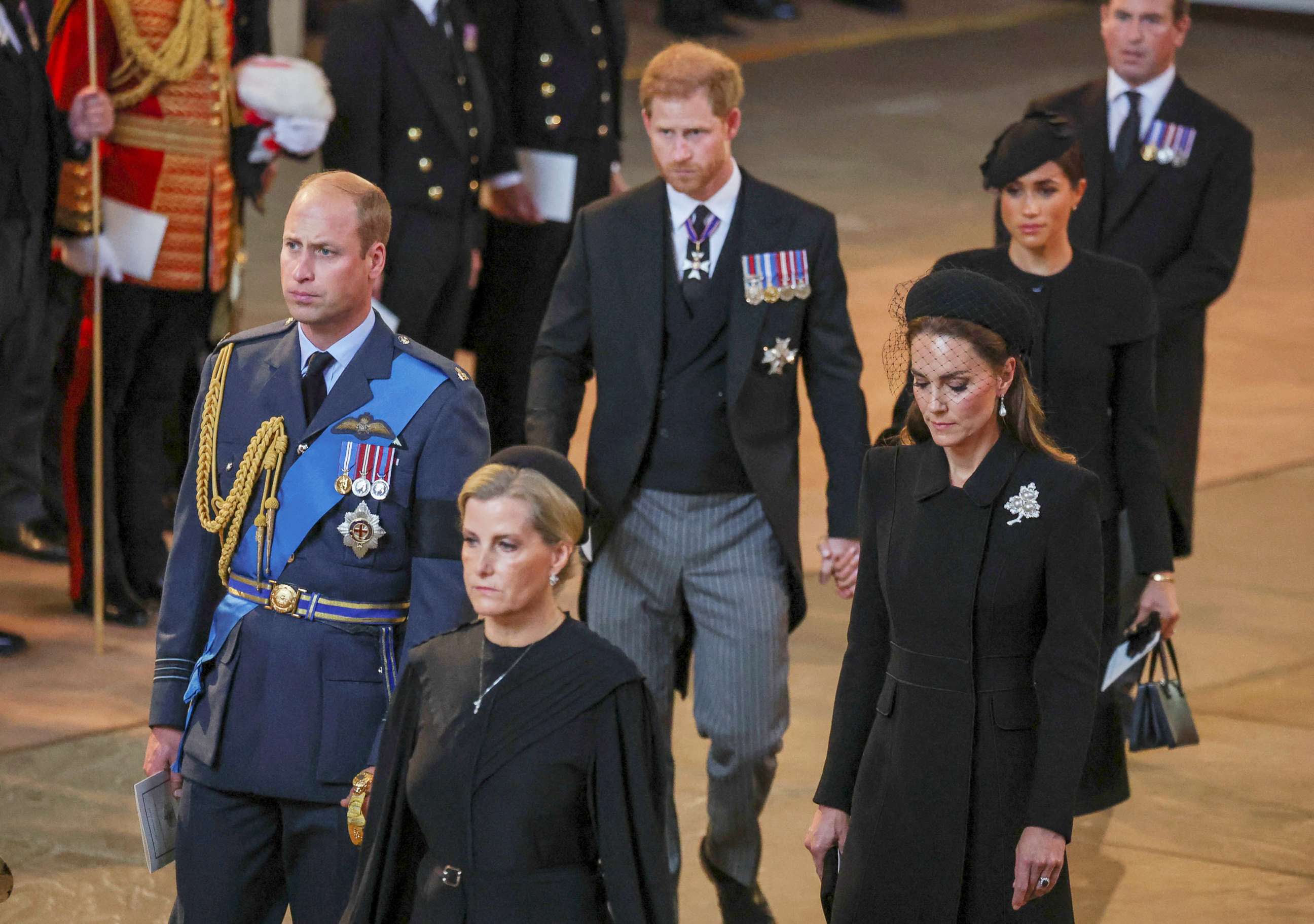 PHOTO: Prince William, Kate, Princess of Wales, Prince Harry and Meghan, Duchess of Sussex walk as the procession with the coffin of Britain's Queen Elizabeth arrives at Westminster Hall in London, Sept. 14, 2022.