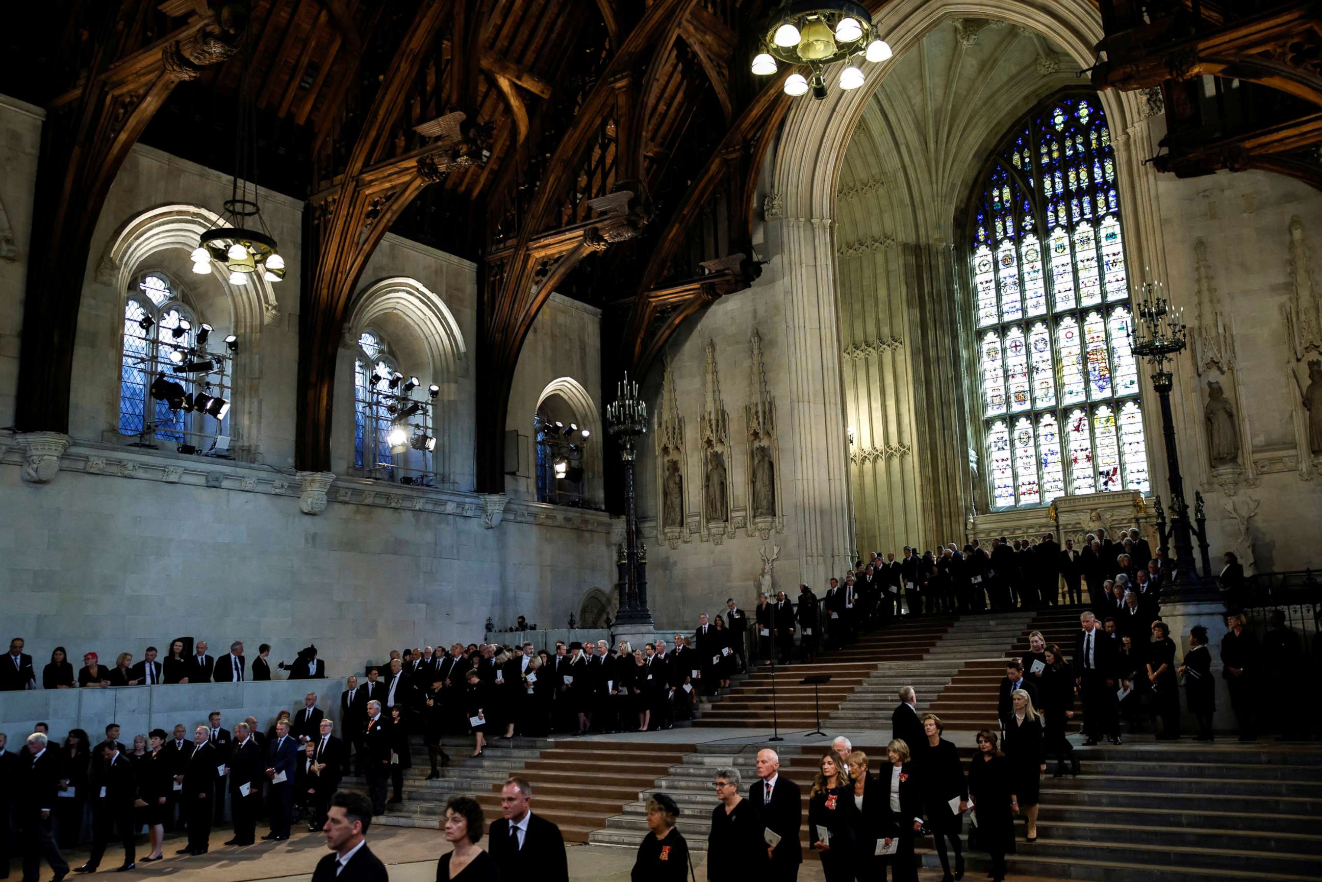 PHOTO: People queue to pay respect to the coffin  of Britain's Queen Elizabeth II after the procession arrived at Westminster Hall from Buckingham Palace for her lying in state, in London, Sept. 14, 2022.