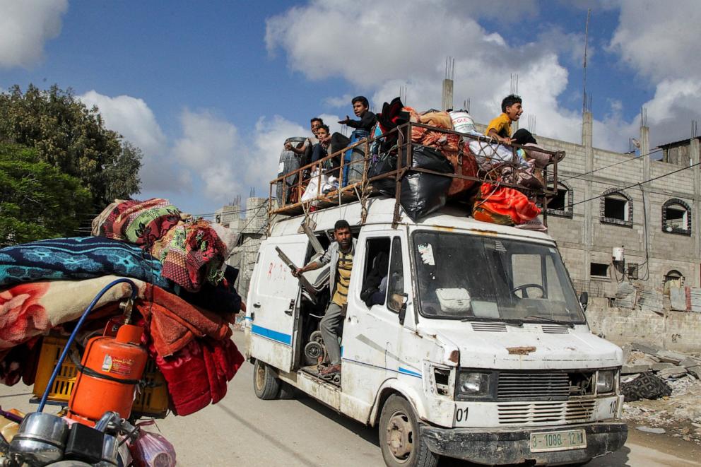 PHOTO: Displaced Palestinians travel in a vehicle as they flee Rafah, amid the ongoing conflict between Israel and Hamas, in Rafah, in the southern Gaza Strip, May 12, 2024.