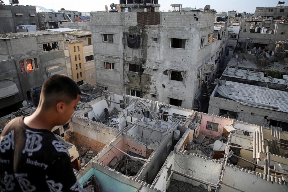 PHOTO: Palestinians inspect houses damaged in an Israeli strike, amid the ongoing conflict between Israel and the Palestinian Islamist group Hamas, in Rafah, in the southern Gaza Strip May 7, 2024.