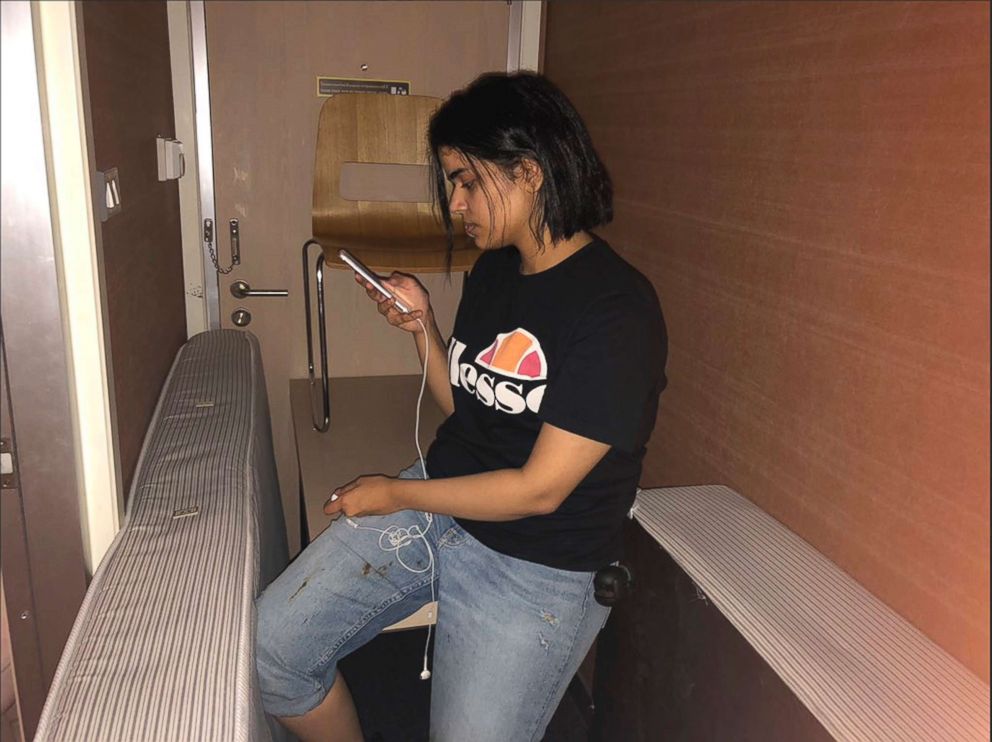 PHOTO: In this Jan. 7, 2019, photo released, Rahaf Mohammed Alqunun views her mobile phone as she sits barricaded in a hotel room at an international airport in Bangkok.