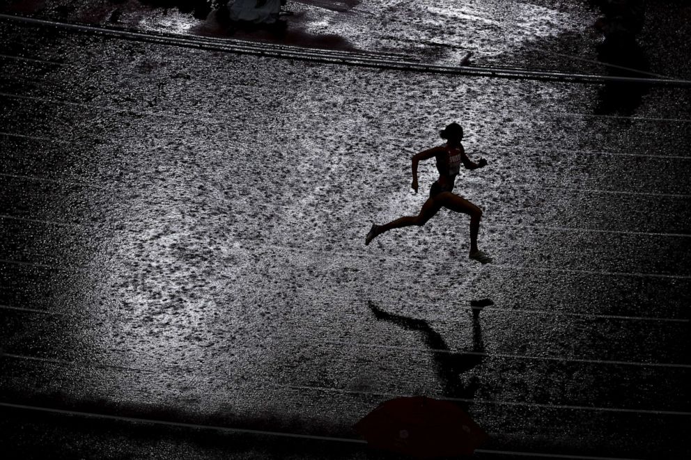 PHOTO: Lea Sprunger of Team Switzerland competes in the rain during the women's 400 metres semifinal on day ten of the Tokyo 2020 Olympic Games at Olympic Stadium on August 02, 2021 in Tokyo, Japan.