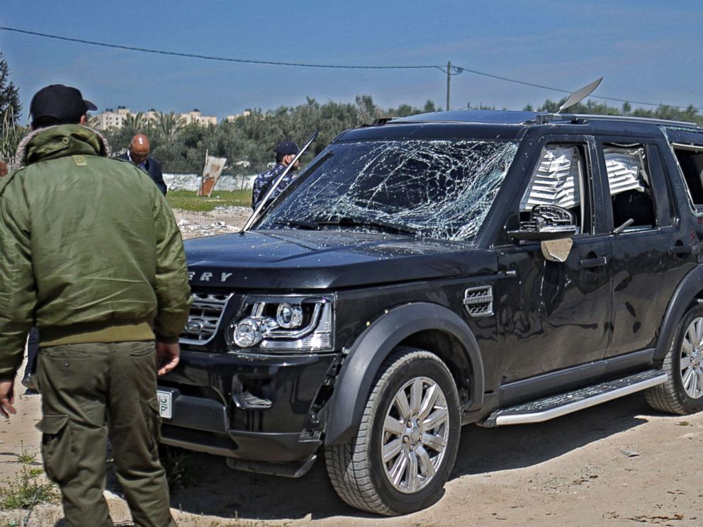 PHOTO: Hamas security officials inspect one of the cars of Palestinian Prime Minister Ramil Hamdallahs convoy that was targeted in an attack after his arrival in Beit Hanun town, the northern Gaza Strip, March 13, 2018.