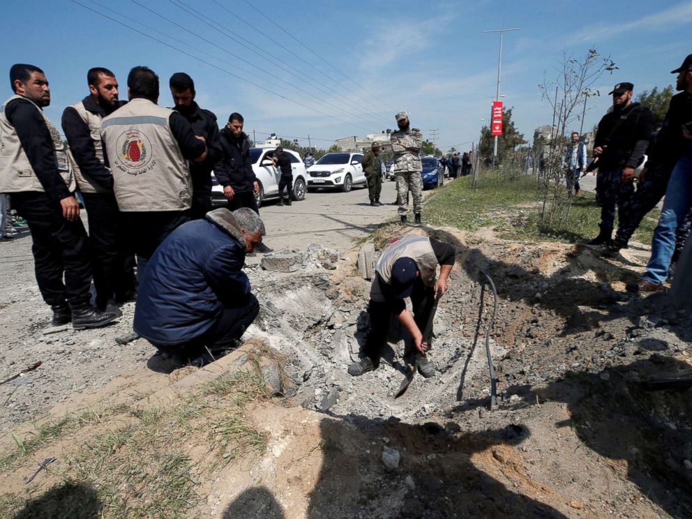PHOTO: Palestinians inspect the site of an explosion that targeted a convoy that was carrying Palestinian Prime Minister Rami Hamdallah, in the northern Gaza Strip March 13, 2018.