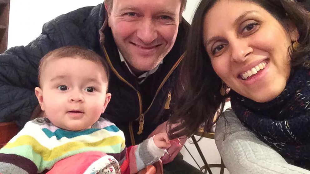PHOTO: An undated handout image shows Nazanin Zaghari-Ratcliffe (R) posing for a photograph with her husband Richard and daughter Gabriella (L).