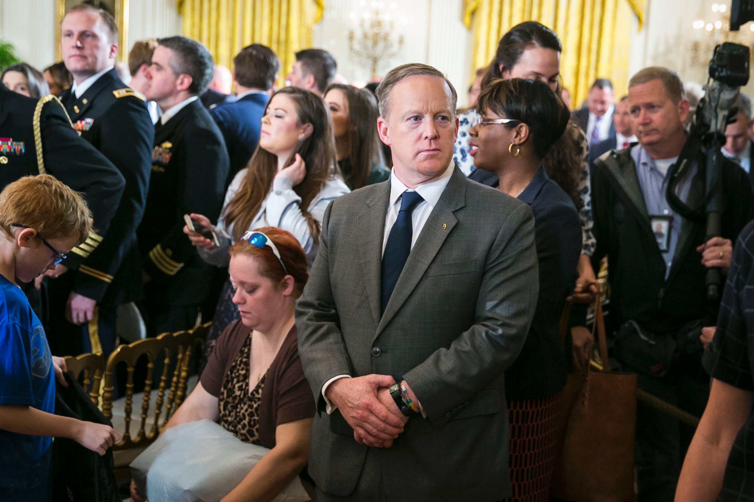 PHOTO: Sean Spicer, White House press secretary, stands at a gathering where President Trump spoke to participants in an annual Wounded Warrior Project Soldier Ride in the East Room at the White House in Washington, April 6, 2017.