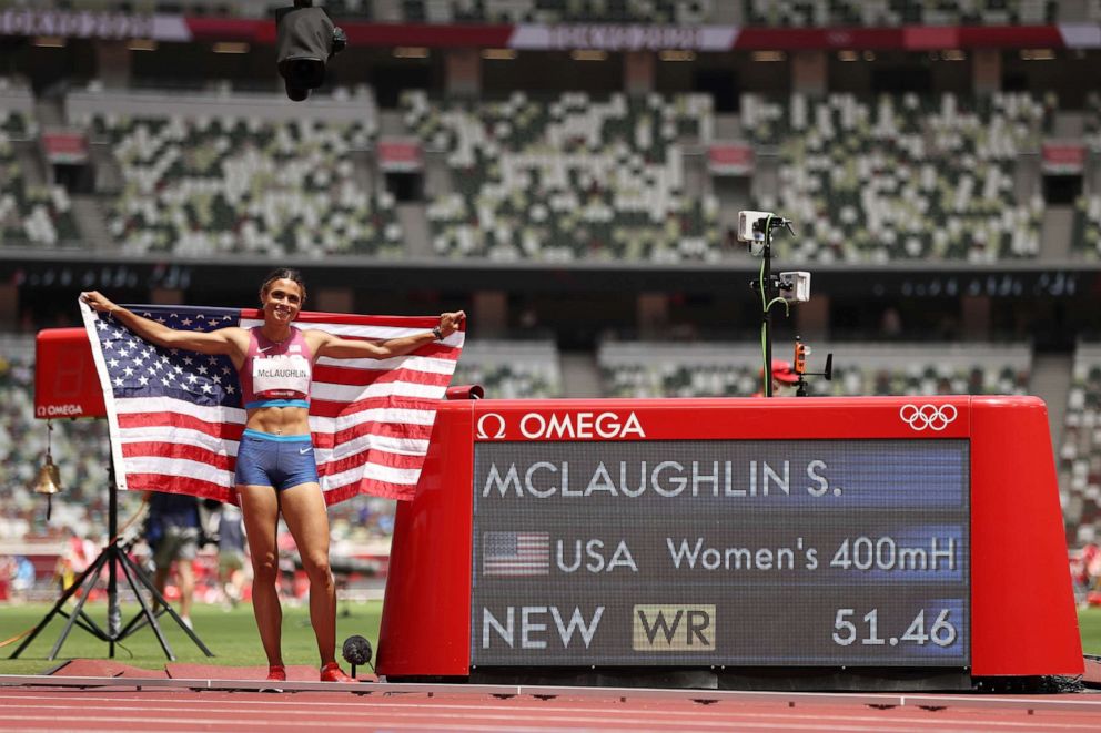 PHOTO: Gold medalist Sydney McLaughlin of Team United States poses in front of the scoreboard after setting a new world record in the Women's 400m Hurdles Final on day twelve of the Tokyo 2020 Olympic Games at Olympic Stadium on Aug. 04, 2021 in Tokyo.