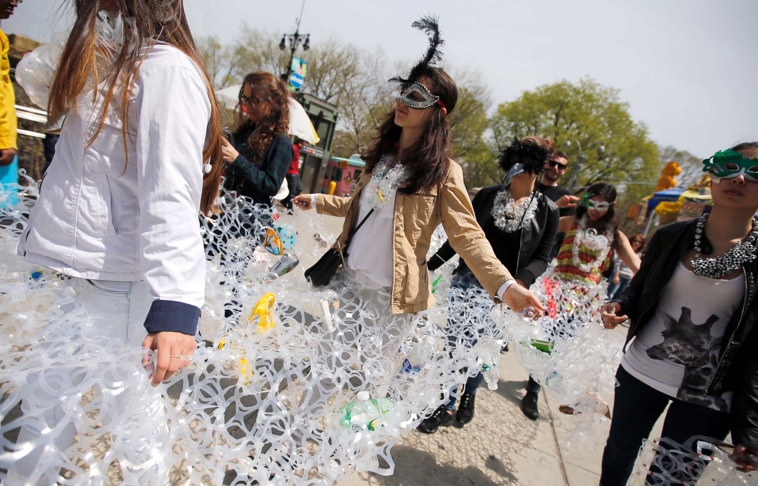 PHOTO: Demonstrators march together in plastic six pack rings during a demonstration to mark Earth Day in Manhattan, April 22, 2014, in this file photo in New York City.