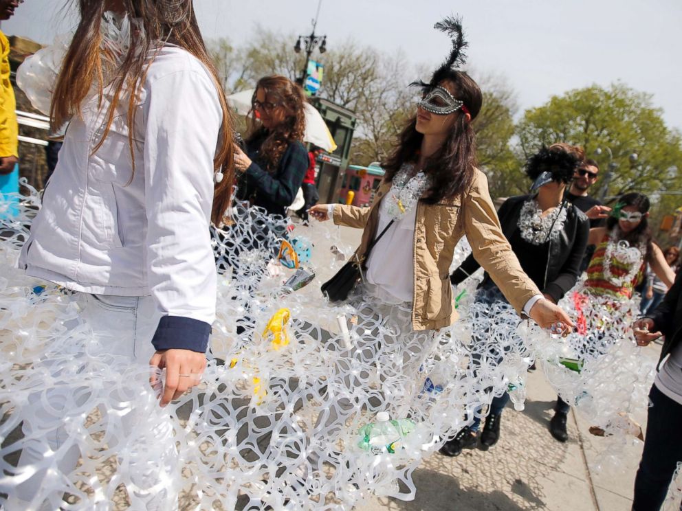 PHOTO: Demonstrators march together in plastic six pack rings during a demonstration to mark Earth Day in Manhattan, April 22, 2014, in this file photo in New York City.