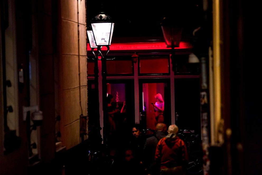 PHOTO: People visit Amsterdam's red light district on July 1, 2020, in the Netherlands.