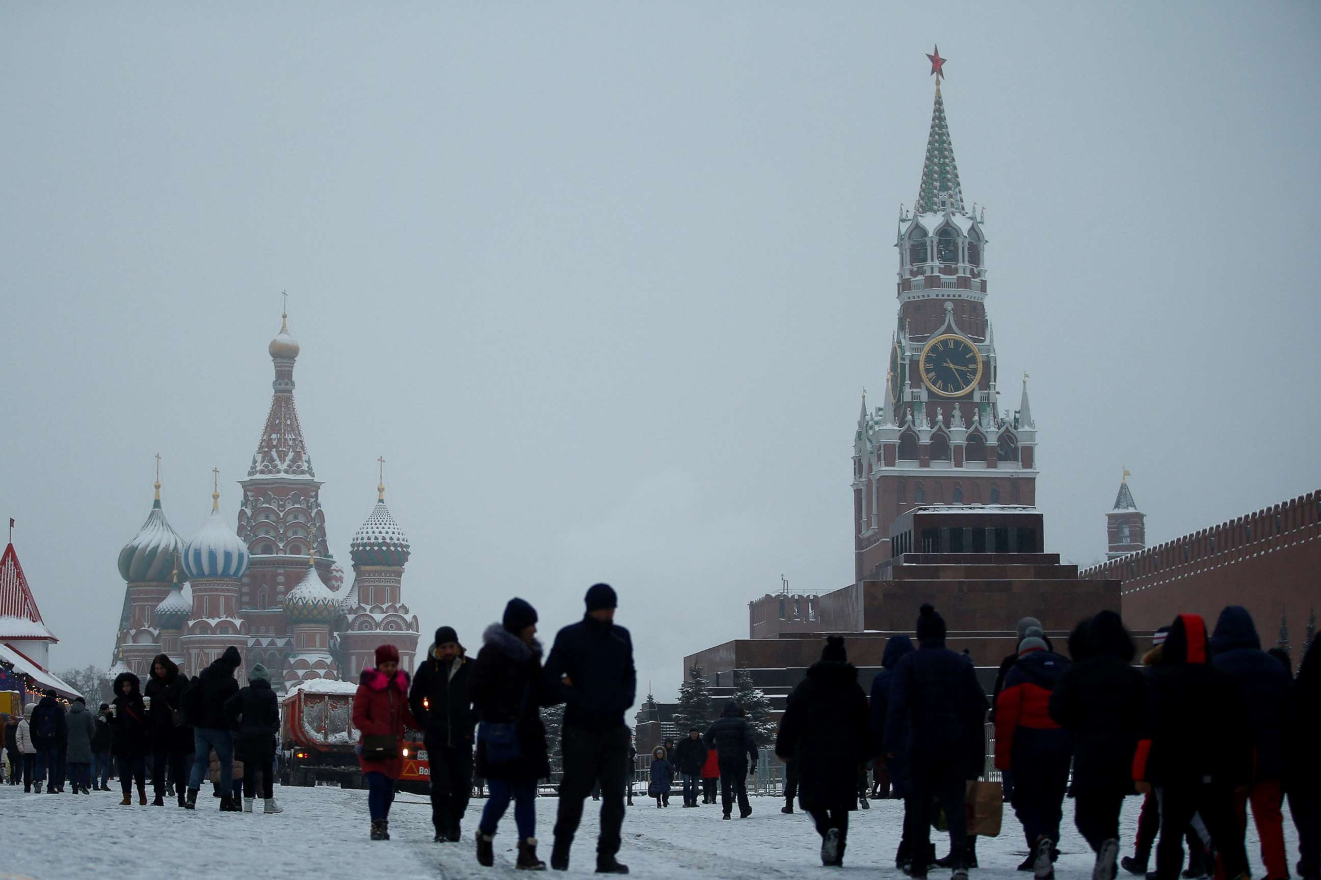 PHOTO: People walk during snowfall in Red Square in Moscow, Dec. 24, 2018.