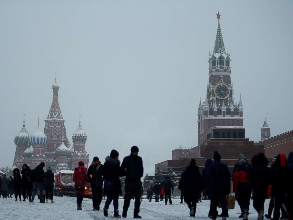 PHOTO: People walk during snowfall in Red Square in Moscow, Dec. 24, 2018.