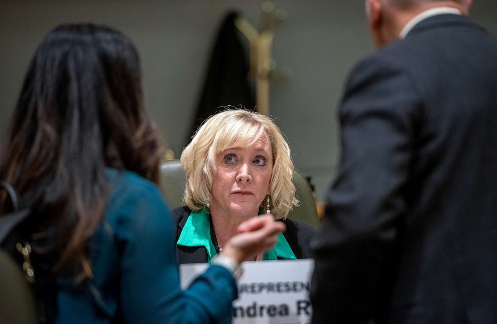 PHOTO: Rep. Andrea Reeb talks with people on the floor of the New Mexico House of Representatives before the start of a session, Feb. 1, 2023, in Santa Fe, New Mexico.