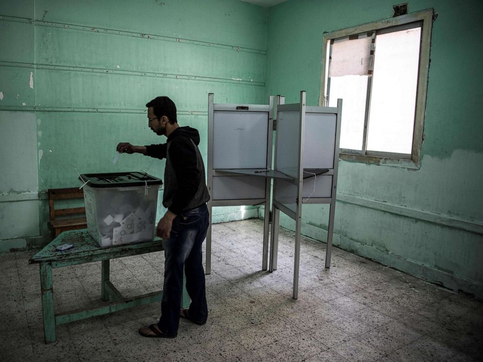 PHOTO: TAn Egyptian man casts his vote in a polling station during the third day of a referendum on constitutional amendments in Cairo, April 22, 2019.