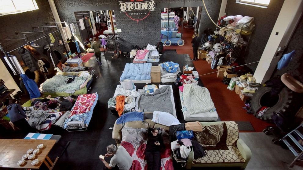 PHOTO: People fleeing their homes due to Russia's invasion of Ukraine shelter at Bronx FitnessHub club, in Lviv, Ukraine, March 23, 2022.