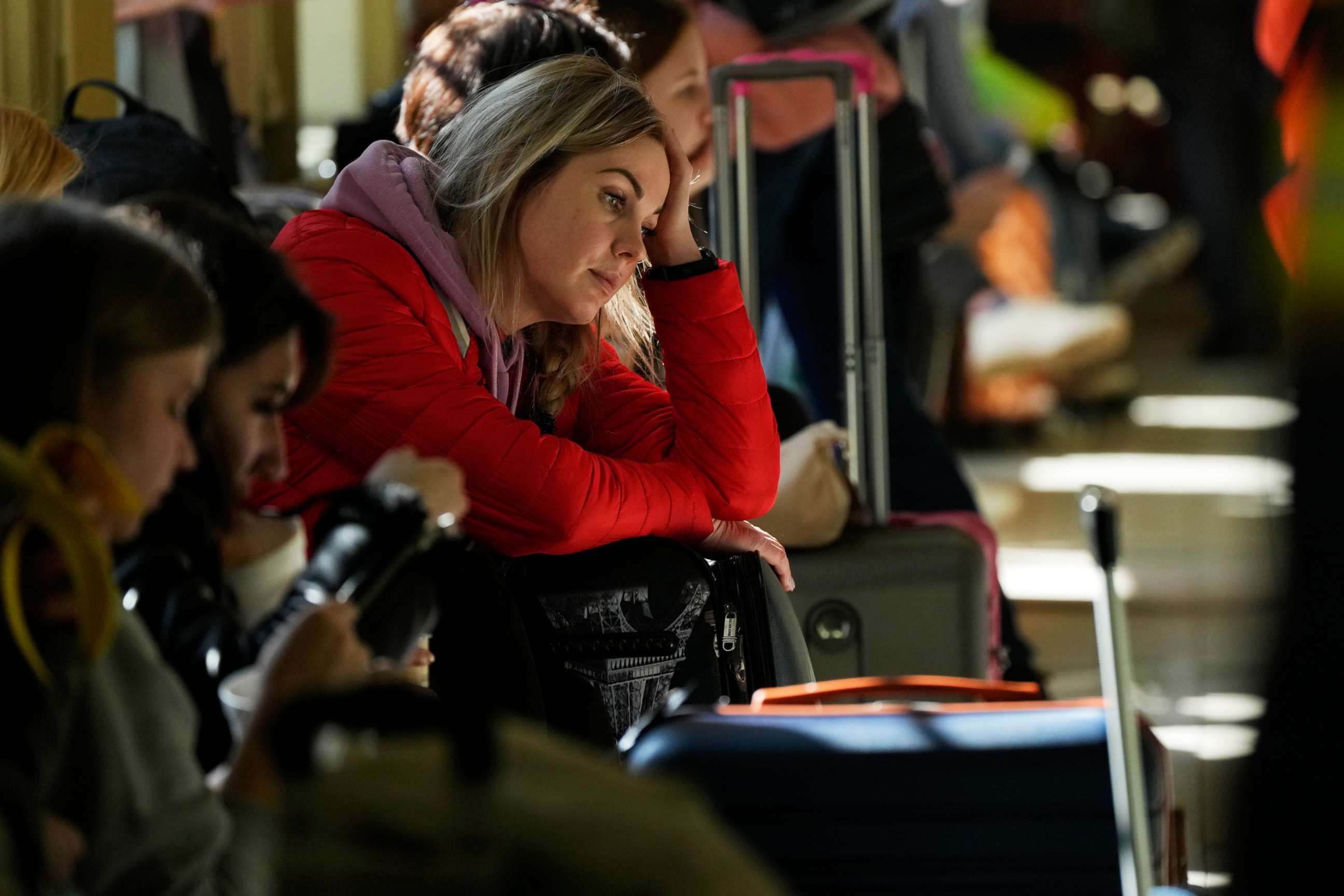 PHOTO:A woman waits for a transport after fleeing the war from neighboring Ukraine at a railway station in Przemysl, Poland, on March 22, 2022
