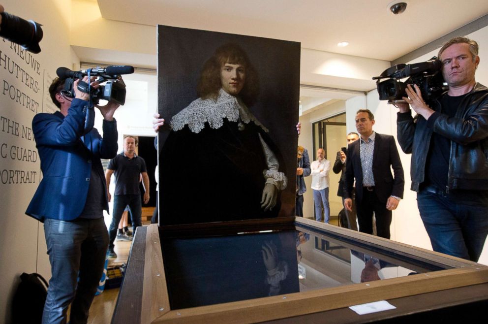 PHOTO: A painting attributed to famous Dutch Master Rembrandt is prepared for display at the Hermitage museum in Amsterdam, May 16, 2018. The unsigned painting which will be sold by gallery owner Jan Six, after being exhibited.