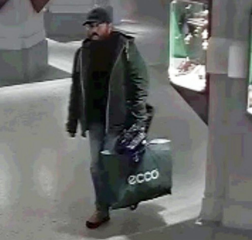 PHOTO: Police in Vienna said that three men believed to be professionals and seen on a surveillance video were stealing a Renoir painting at the Dorotheum auction house on November 26, 2018.