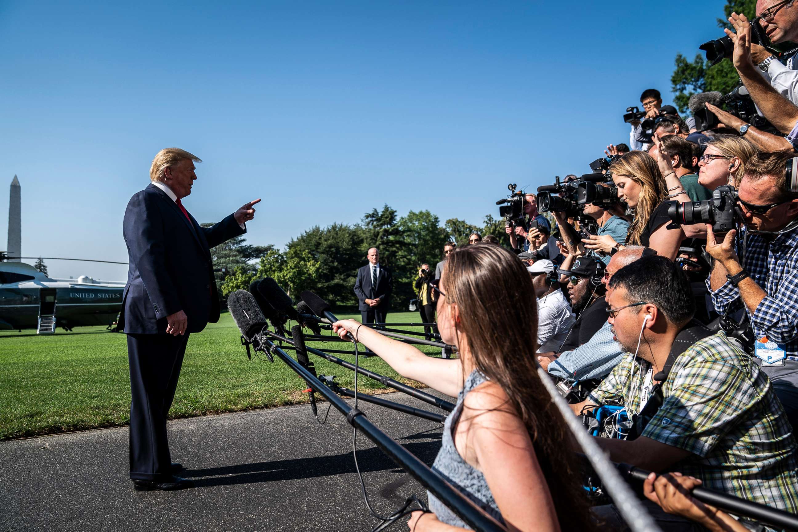 PHOTO: In this July 30, 2019, file photo, President Donald Trump stops to talk to reporters and members of the media as he walks to board Marine One and depart from the South Lawn at the White House in Washington, DC.