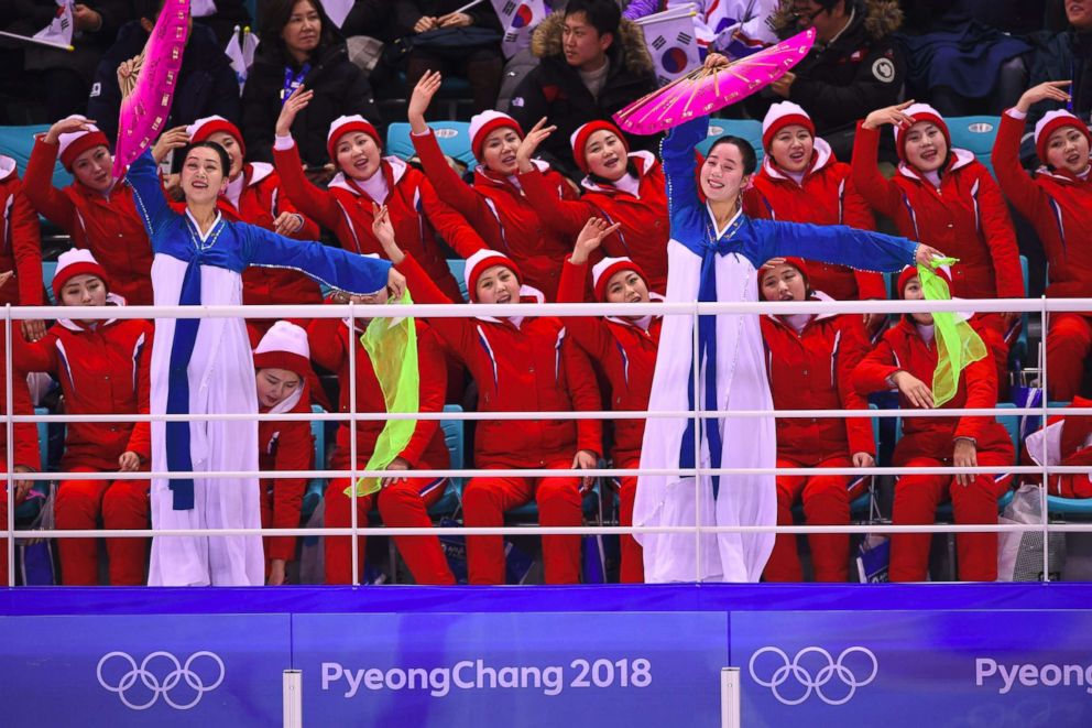 PHOTO: North Korea's cheerleaders cheer during the women's preliminary round ice hockey match between Switzerland and the Unified Korean team, Feb. 10, 2018. 