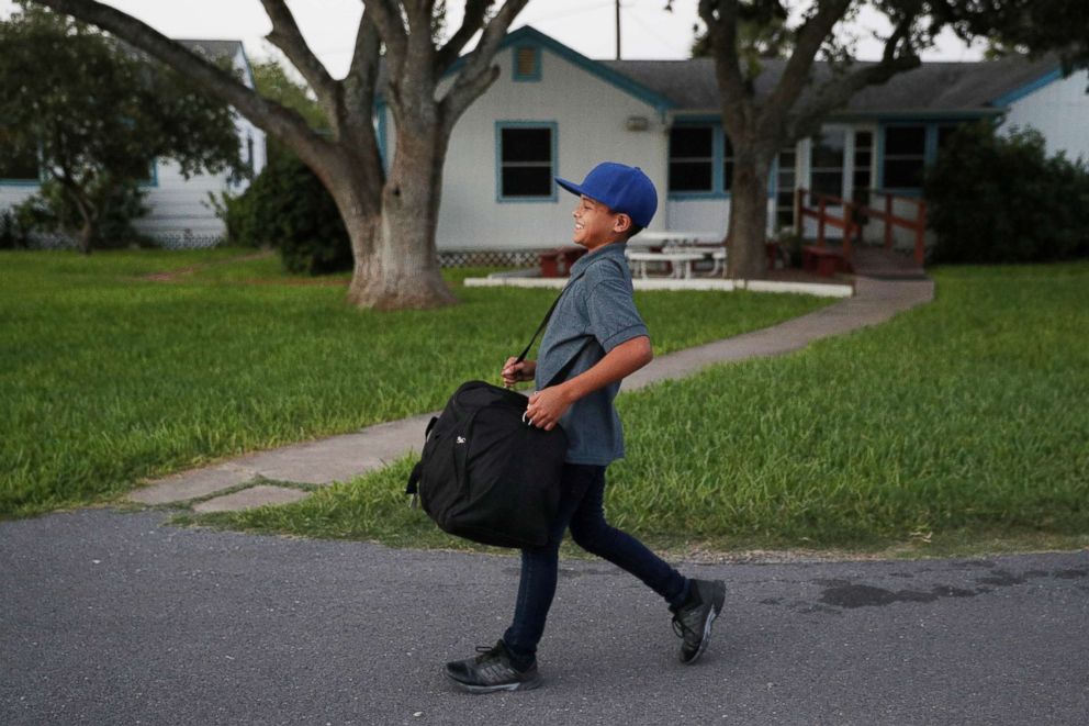 PHOTO: Abisai Montes Marroquin, 11, arrives at La Posada Providencia shelter shortly after being reunited with his mother in San Benito, Texas, July 14, 2018.