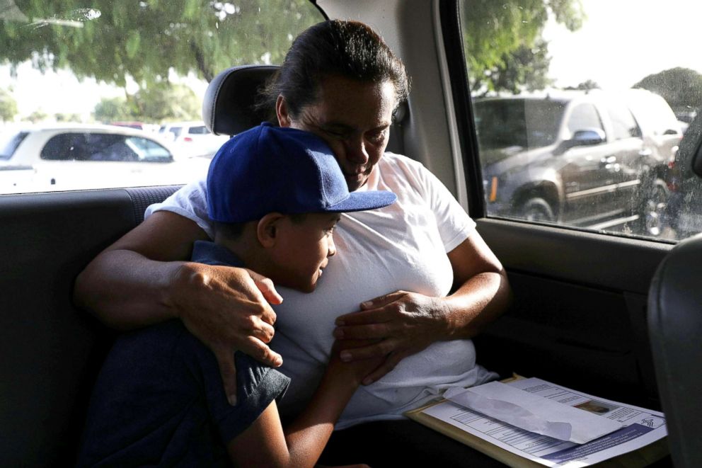 PHOTO: Maria Marroquin Perdomo and her 11-year-old son Abisai drive away from the Casa Padre facility in the backseat of her attorney's truck minutes after mother and son were reunited, in Brownsville, Texas, July 14, 2018.