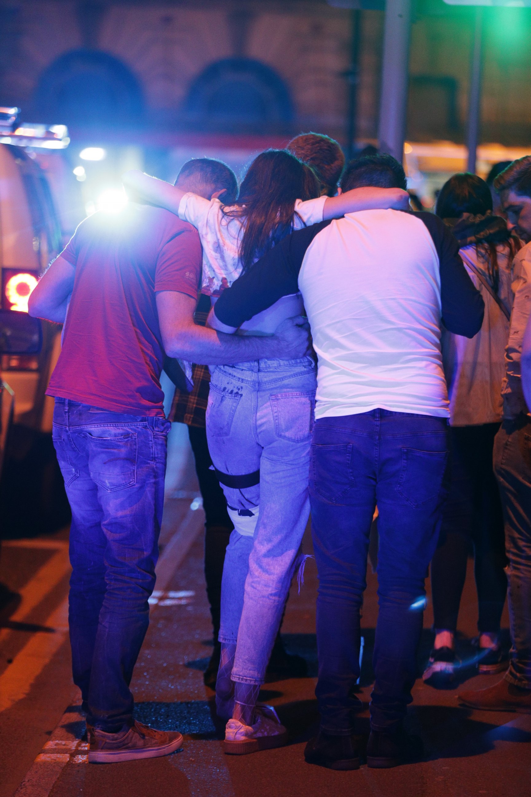 PHOTO: People help an injured woman walk near the Manchester Arena after reports of an explosion on May 22, 2017 in Manchester, England.