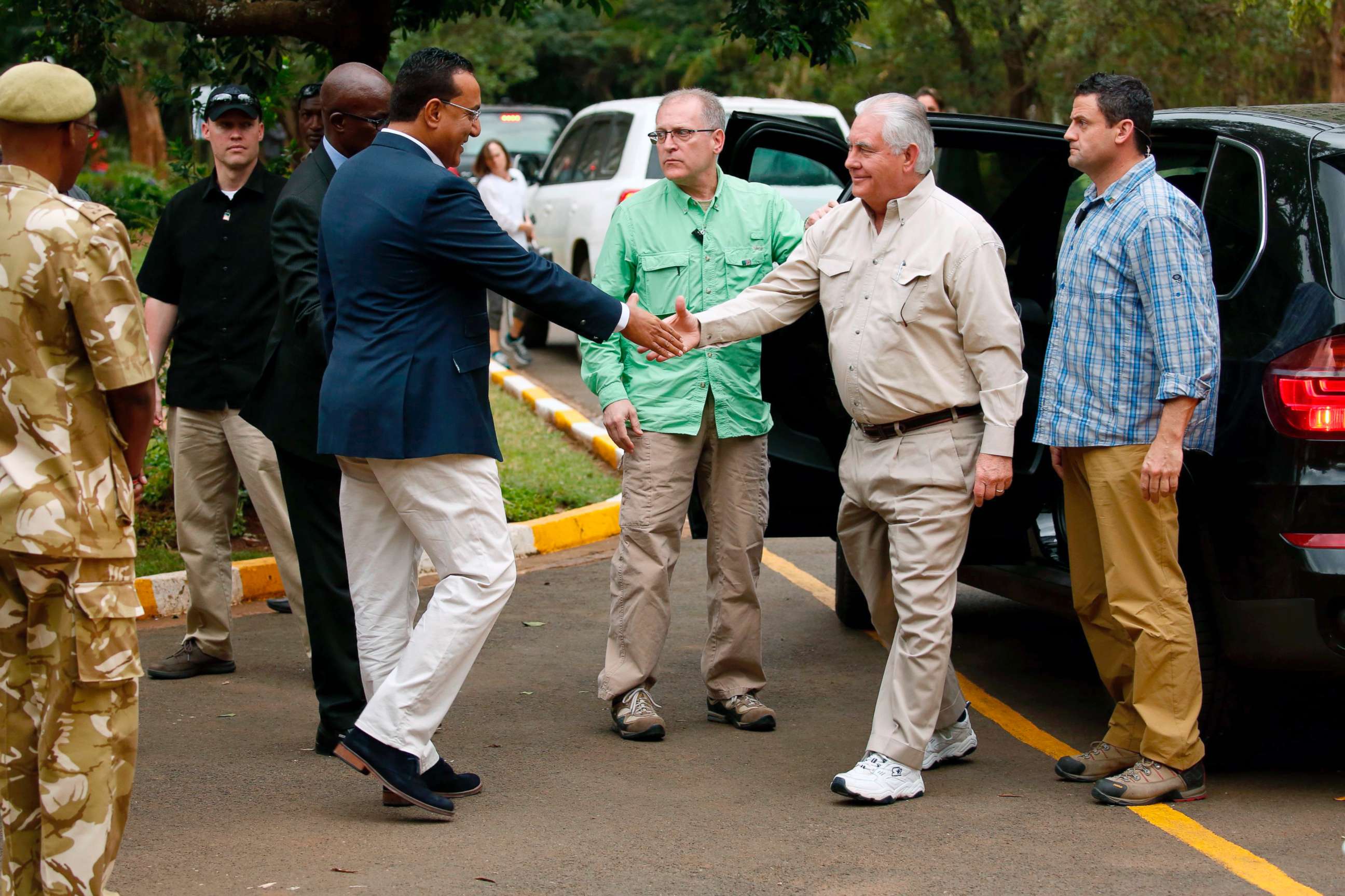 PHOTO: Kenya's Cabinet Secretary for Tourism Najib Balala (2-L) shakes hands with US Secretary of State Rex Tillerson (2-R) prior to a tour of the Kenya Wildlife Service in Nairobi, on March 11, 2018. 