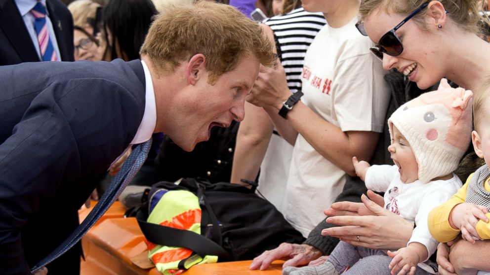 PHOTO: Prince Harry greets a baby at Cashel Street Mall in Christchurch, New Zealand, May 12, 2015.