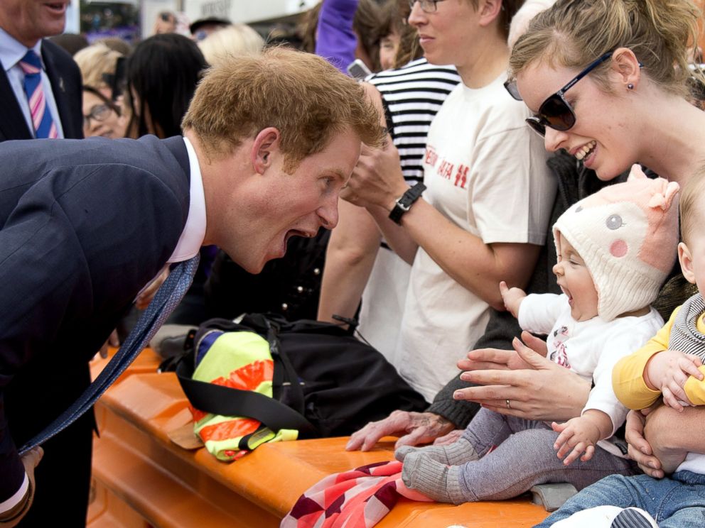 PHOTO: Prince Harry greets a baby at Cashel Street Mall in Christchurch, New Zealand, May 12, 2015.